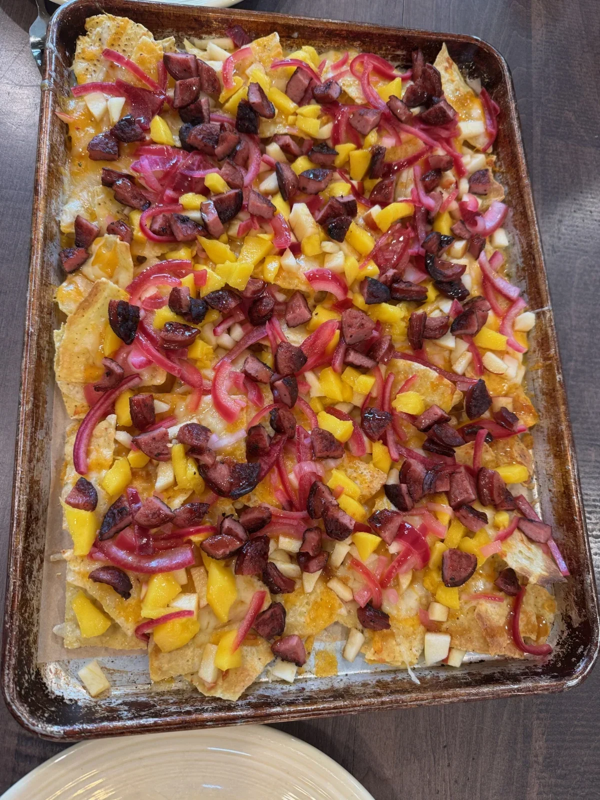 Hot Honey Kielbasa & Smoked Gouda nachos from our kitchen