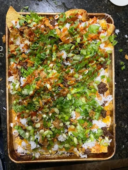 Five Trays from the Notebook nachos from our kitchen