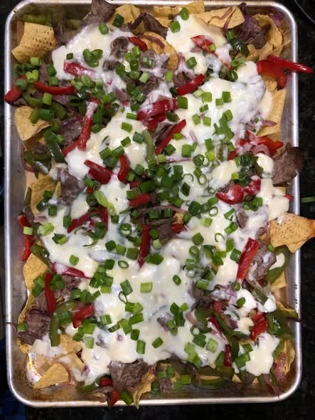 Philly Cheesesteak & the Meat Medley nachos from our kitchen